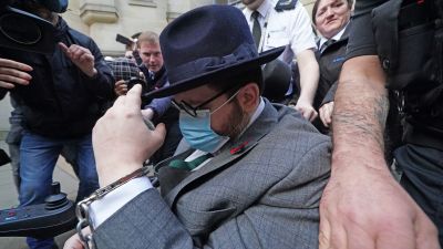 Nicholas Rossi leaving court in Scotland on 11 November.
Credit: PA