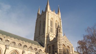 Looking up at the tower of a cathedral