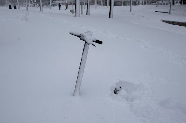 People walk during a heavy snowfall in Rivas Vaciamadrid, Spain.