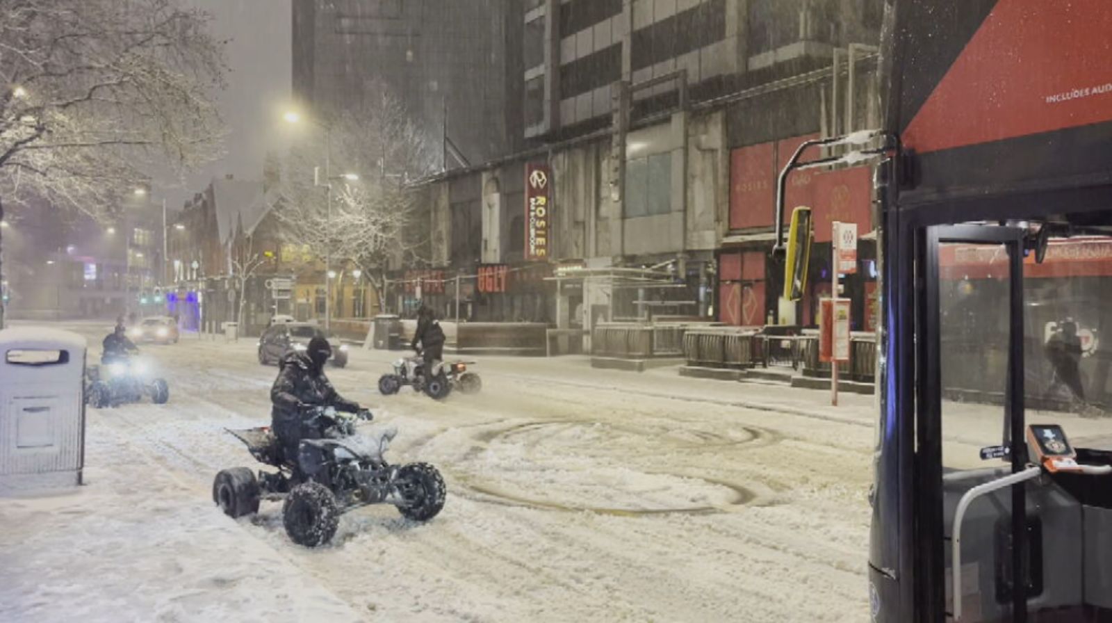 Quad bikers appear to block bus as they ride through snow in Birmingham