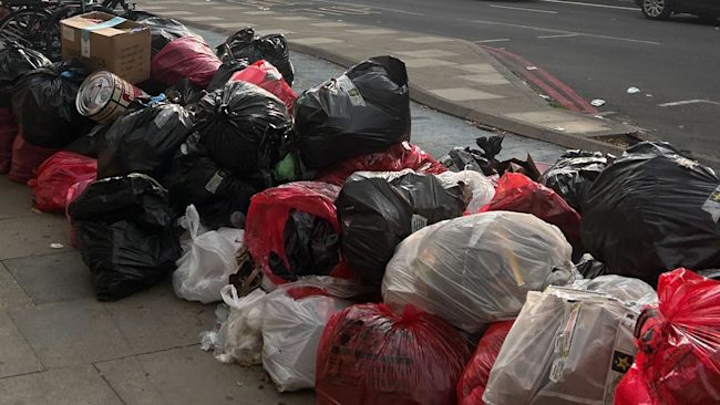 RUBBISH PILES UP IN EAST LONDON