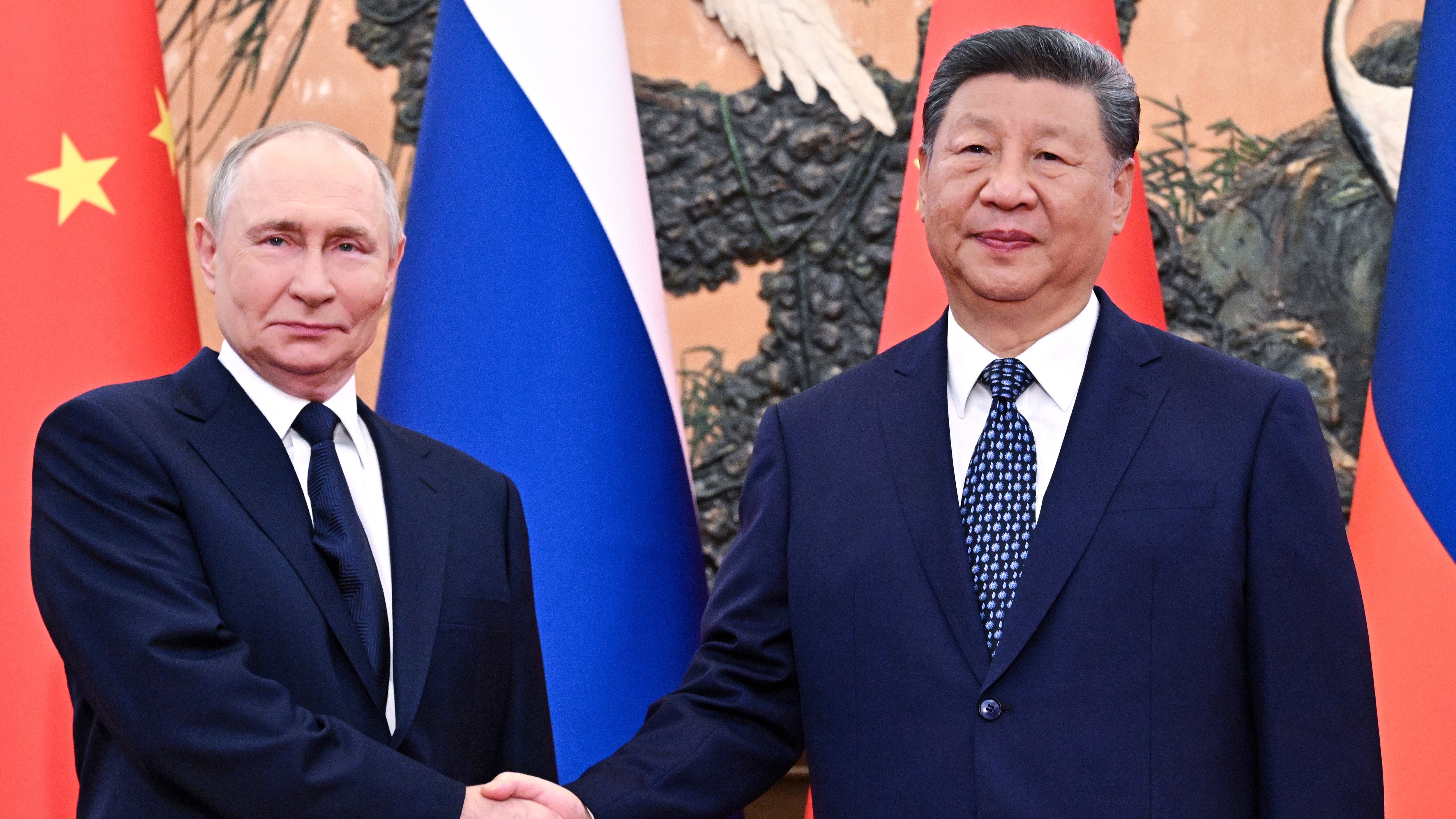 Xi welcomes his 'old friend' Putin to Beijing for a show of togetherness