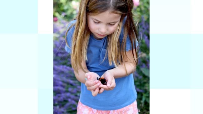 Princess Charlotte holding a butterfly