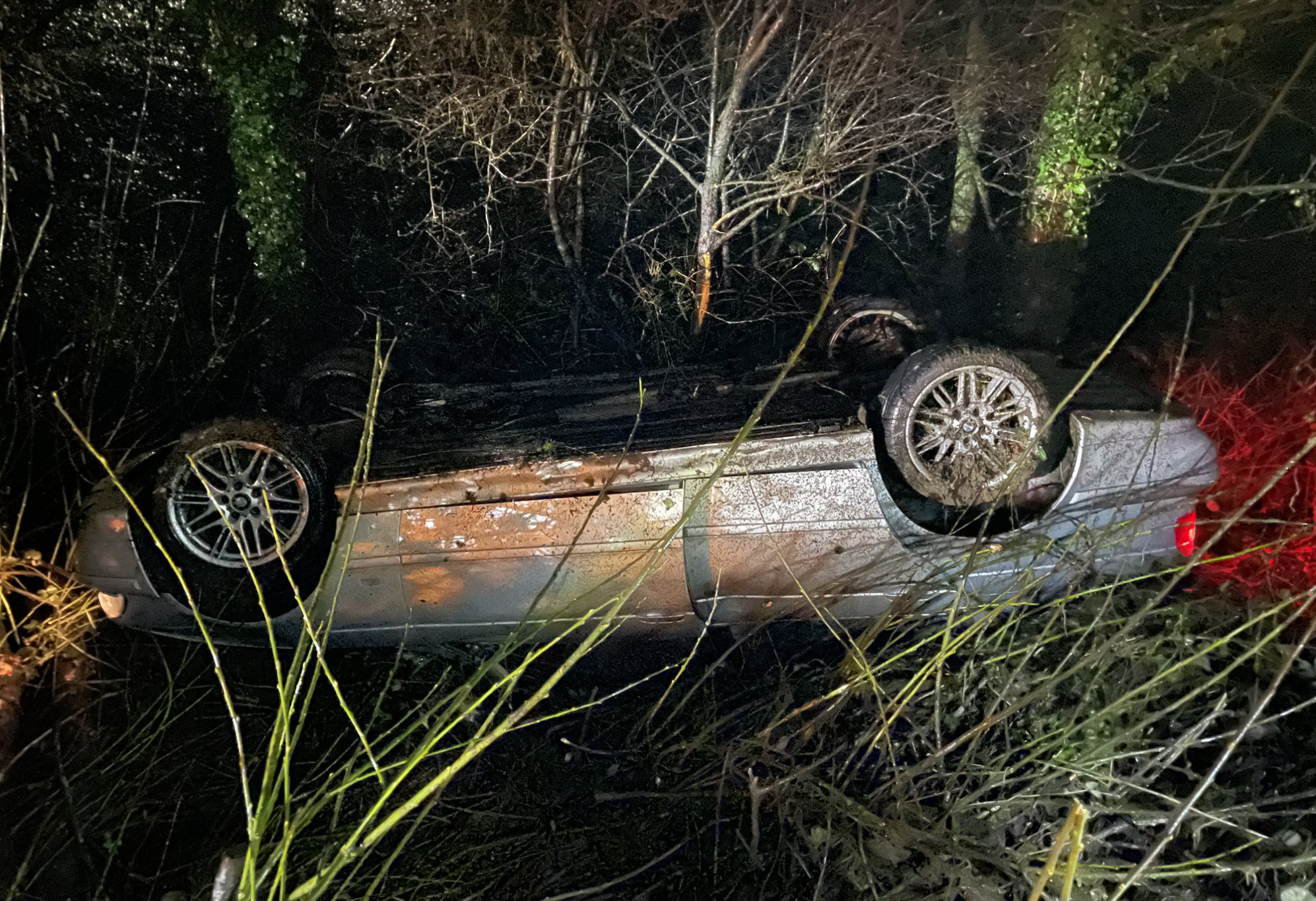 Car leaves Devon A38 and flips on roof just inches away from river ...