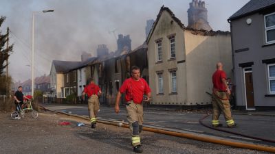 Firefighters at the scene of a blaze in the village of Wennington, east London. London Fire Brigade has declared a major incident due to "a huge surge" in blazes across the capital amid the 40C heat. Picture date: Tuesday July 19, 2022.
