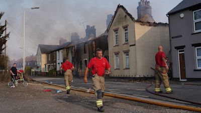 Firefighters at the scene of a blaze in the village of Wennington, east London. London Fire Brigade has declared a major incident due to "a huge surge" in blazes across the capital amid the 40C heat. Picture date: Tuesday July 19, 2022.