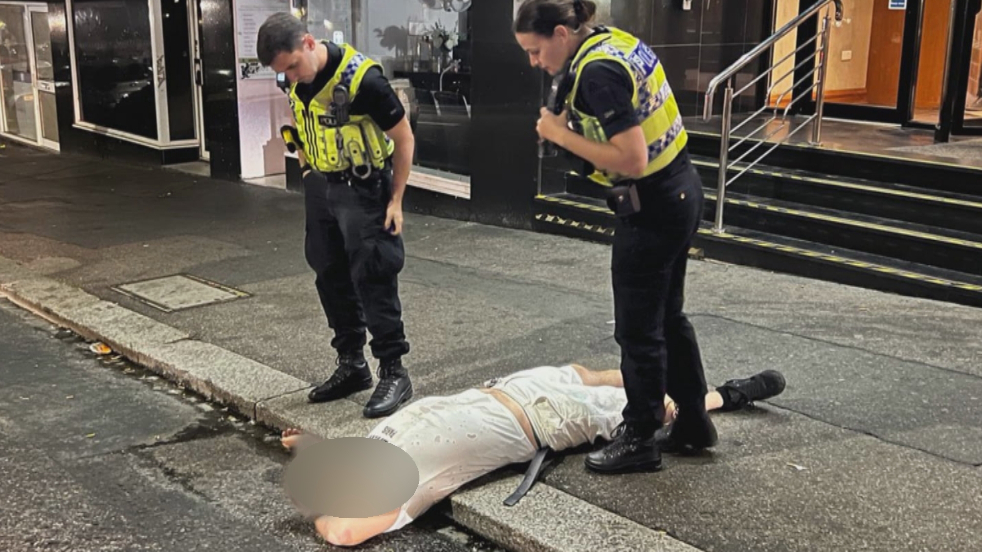 Drunk man lies on pavement in protest after trying to get into wrong ...