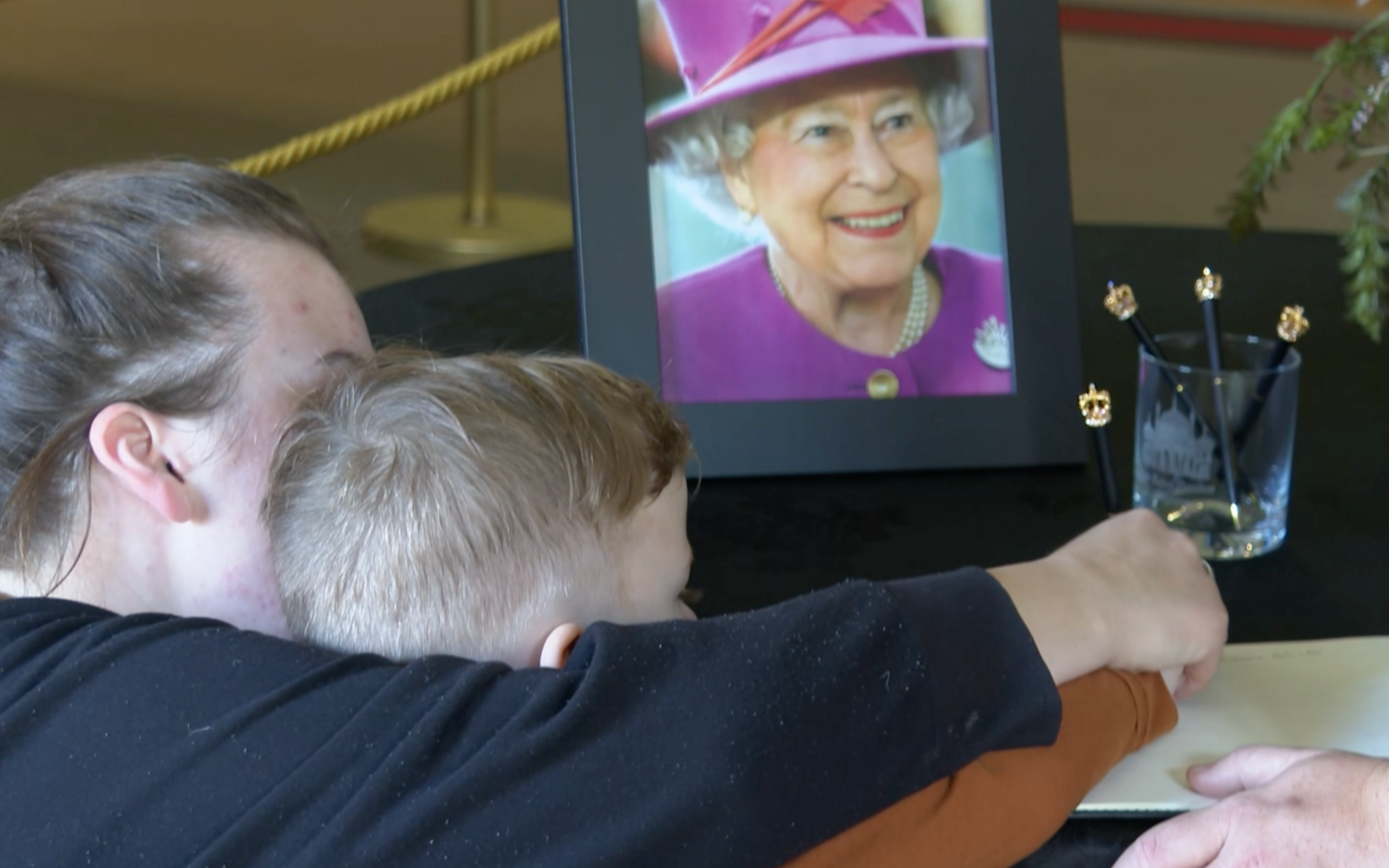 Church bells ring out for the new King, as condolence book for the