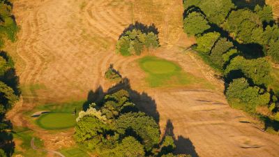 The dried out greens and fairways of Ashton Court Golf Course, near Bristol