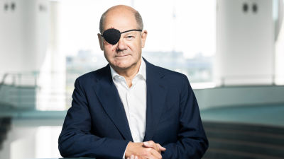 Olaf Scholz pictured wearing an eye-patch.