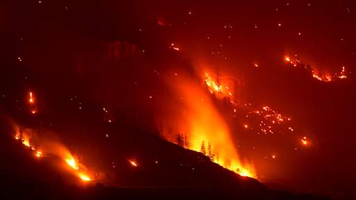 Wildfires in Canada force 20,000 people to flee as state of emergency declared