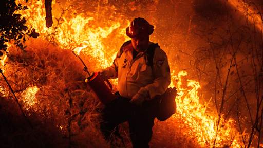 Raging wildfires near Los Angeles force thousands to evacuate their homes