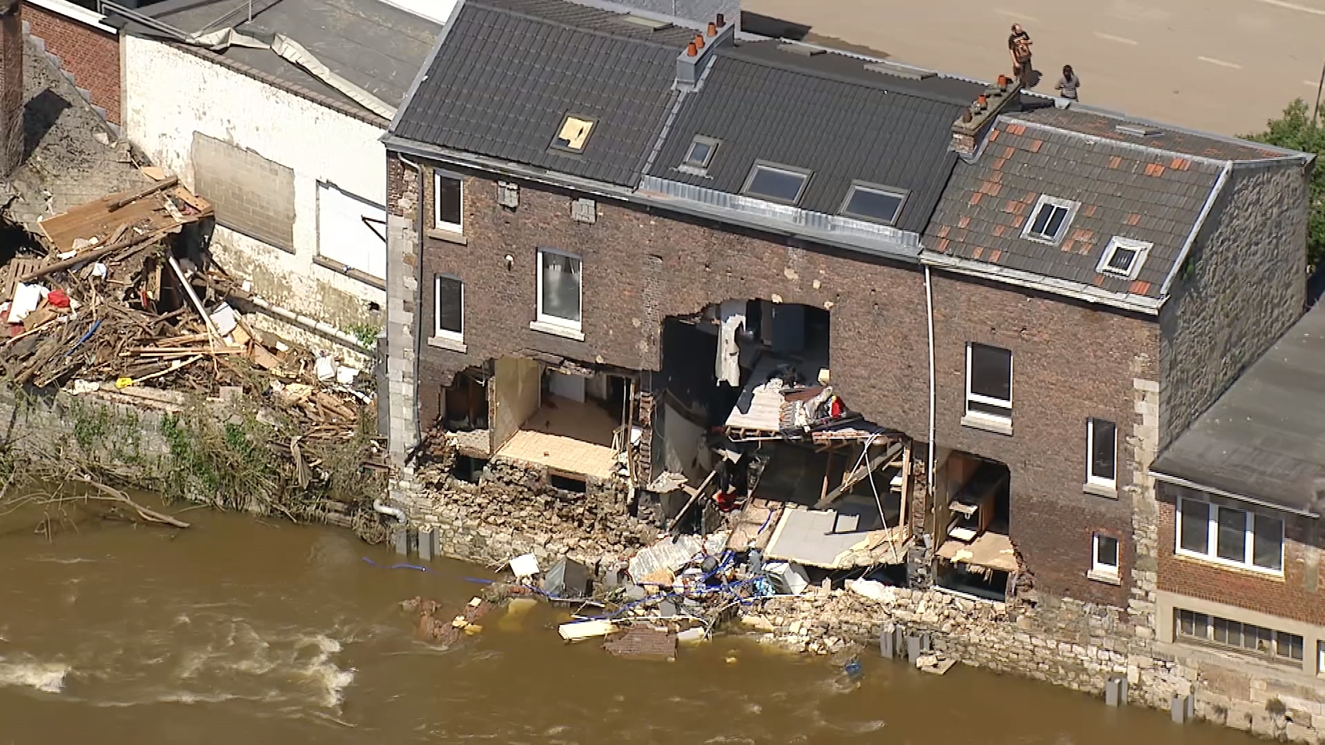 Footage shows damaged homes and debris-lined streets along river after ...