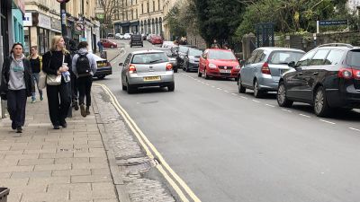 Pedestrians and motorists currently compete for space on Cotham Hill in Bristol