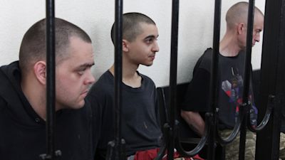 090622, Aiden Aslin, a man thought to be Moroccan Saaudun Brahim, and Shaun Pinnner, AP