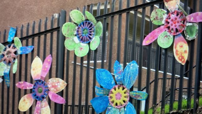 Floral motifs made from recycled discarded hubcaps