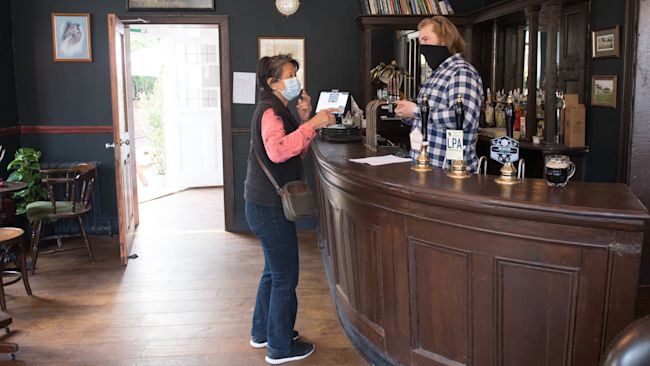 A customer at the The Carlton Tavern in Maida Vale, London
