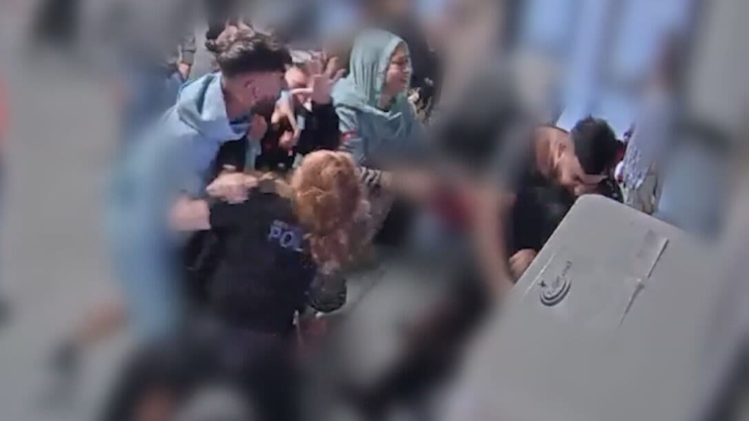 Man accused of attacking Manchester Airport officers denies use of