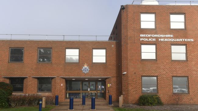 A brick building with 'Bedfordshire Police Headquarters' on the outside