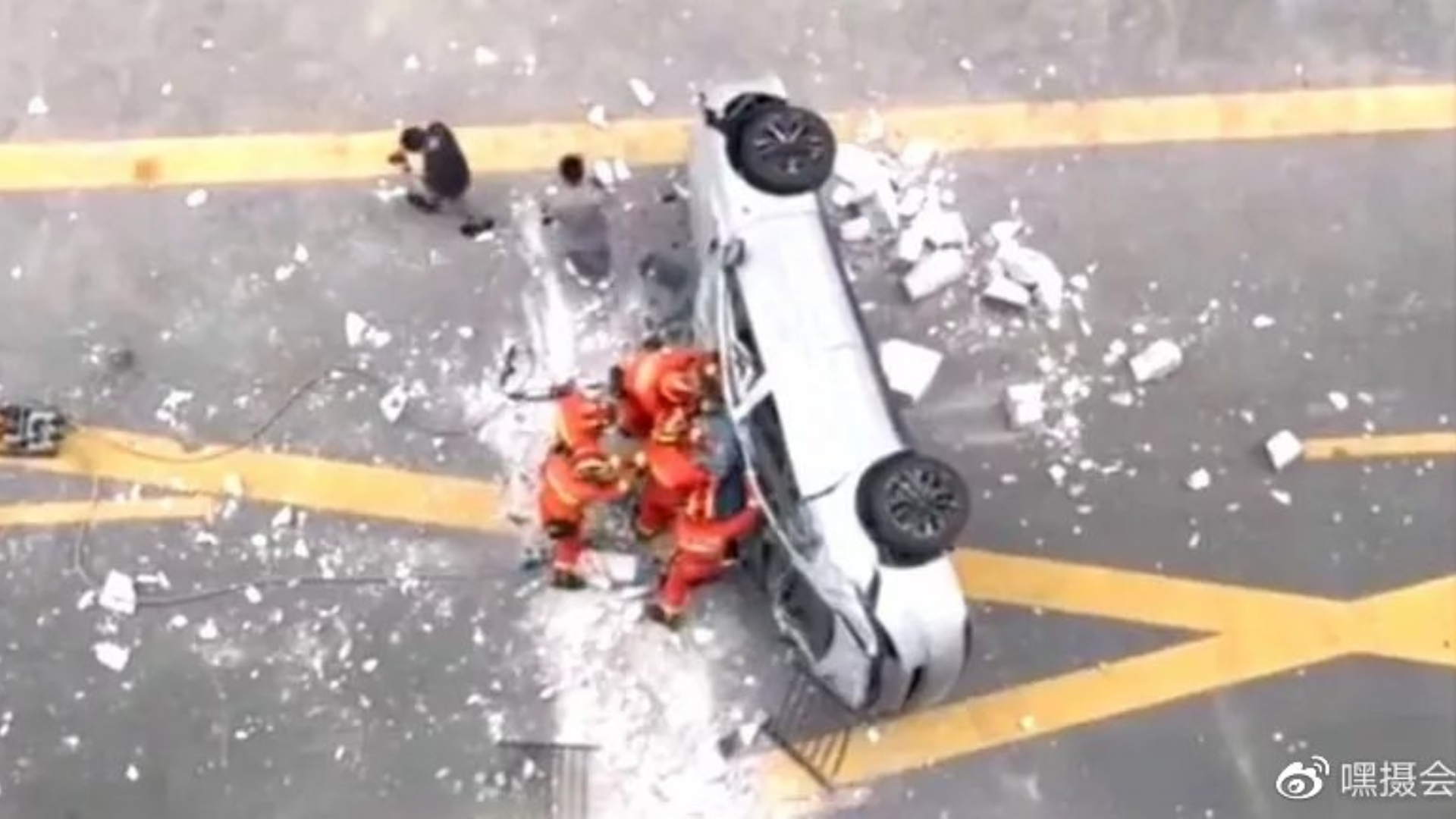 Two killed as NIO electric car falls from third floor of Shanghai