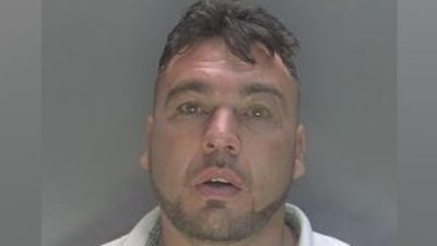 Mug shot of John Holmes issued by Cambridgeshire Police