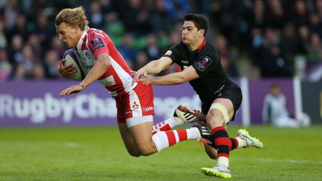 Gloucester's Billy Twelvetrees beats the tackle of Edinburgh's Phil Burleigh to score their first try during the European Rugby Challenge Cup Final at Twickenham Stoop, London. PA