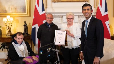 Burrow and Rishi Sunak - Burrow being presented with Point of Light award