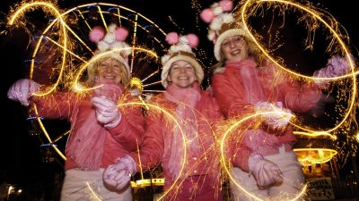 Dawn, Lily Page and Emma Wickes from Kidderminster on Princes Street ahead of the Hogmany street party.  David Cheskin/PA