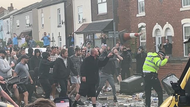 Right-wing rioters clash with police in Southport.