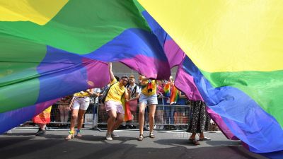 People take part in the Pride in London Parade in central London.