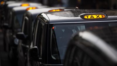 A queue of black cabs outside Victoria Station, London
