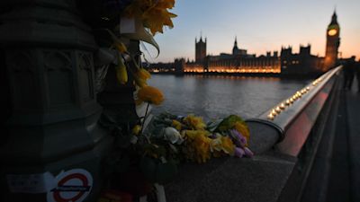 Flowers and candle lights on Westminster Bridge, London as two more "significant arrests" have been made in connection with the Westminster attack, police have said.