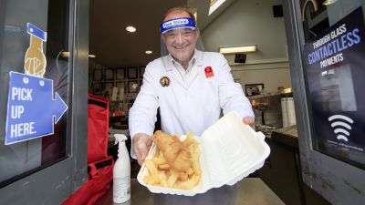 040920 Liberal Democrat leader Ed Davey undertakes a 'shift' in Taylor's chip shop, in Stockport, during the start of his national listening tour PA