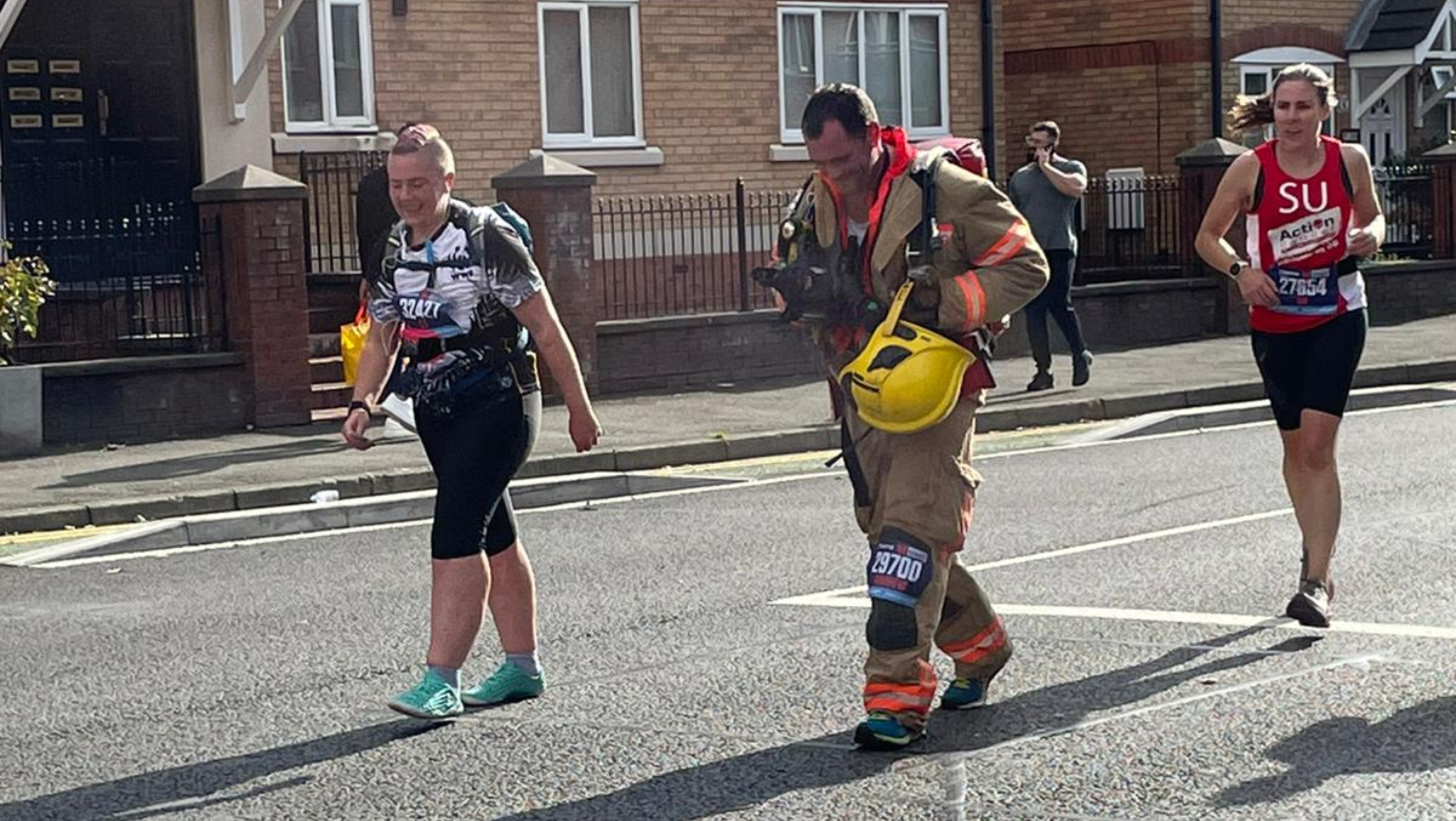 Fire fighters take part in the 28th Hamburg marathon in Hamburg