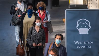 Passengers wearing face masks at Waterloo station in London as face coverings become mandatory on public transport in England with the easing of further lockdown restrictions during the coronavirus pandemic.