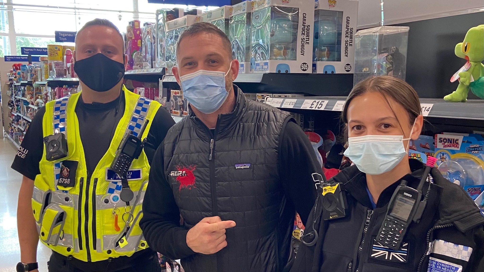 Welsh police officers take a selfie in a supermarket with ...