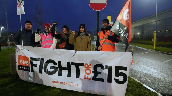 Members of the GMB union, on the picket line outside the Amazon fulfilment centre in Coventry, as Amazon workers stage their first ever strike in the UK in a dispute over pay. Picture date: Wednesday January 25, 2023.