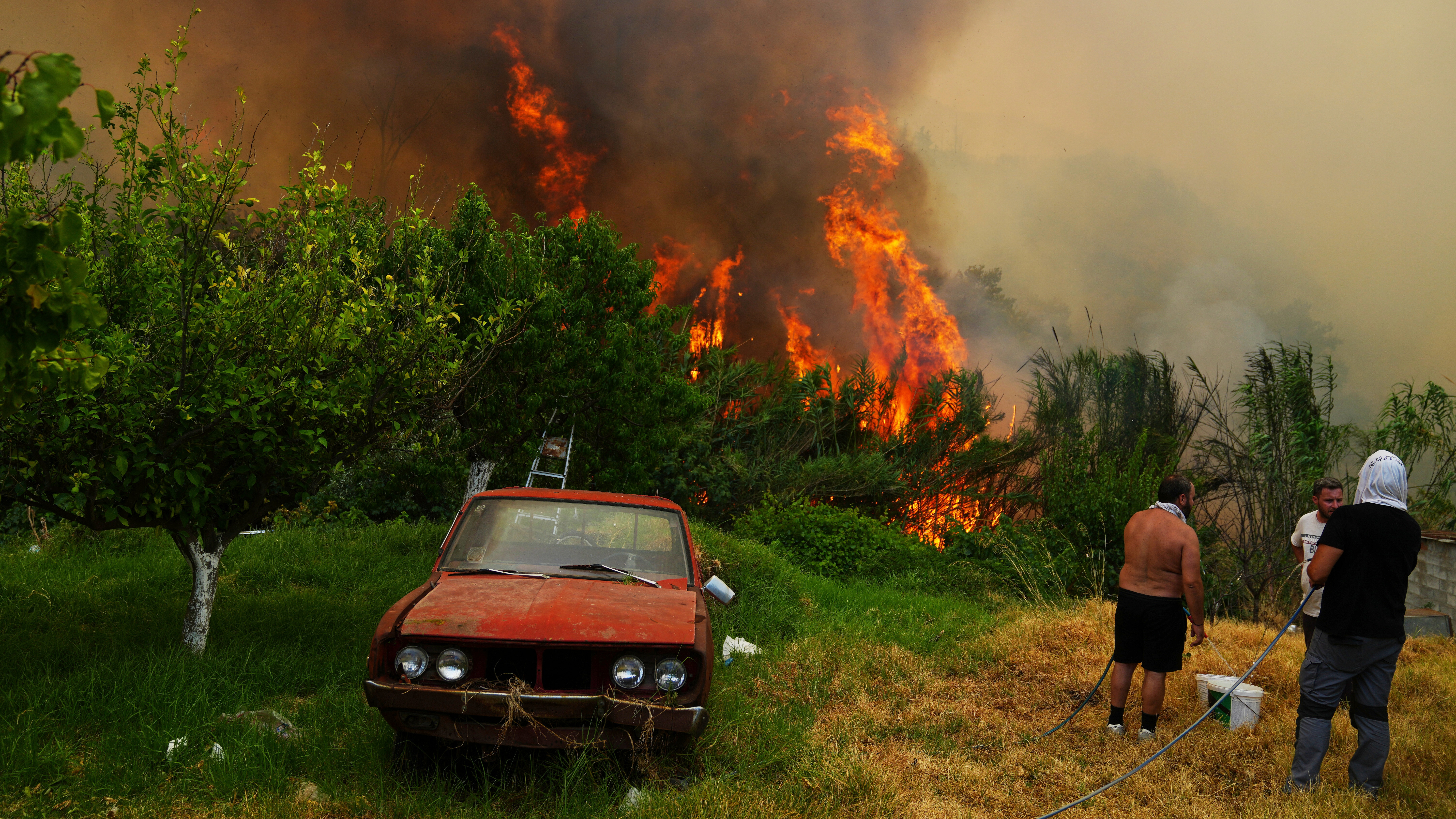 At least three dead as wildfires rage across southern Europe