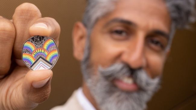 The Royal Mint has revealed a new 50p coin to mark the 50th anniversary of the UK Pride movement.

It said this will be the first time the UK’s LGBTQ+ community has been recognised on an official coin.

The new coin has been designed by east London artist and activist Dominique Holmes.

The design, which includes the historic Pride progression flag, is inscribed with Pride in London’s values of protest, visibility, unity, and equality in rainbows.

'This queer brown immigrant has come a long way'