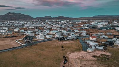 This image taken with a drone shows the town of Grindavik, Iceland, Thursday, Nov. 16, 2023. Residents of a fishing town in southwestern Iceland have left their homes after increasing concern about a potential volcanic eruption caused civil defense authorities to declare a state of emergency in the region. Iceland's Meteorological Office says police decided to evacuate Grindavik after recent seismic activity in the area moved south toward the town. (AP Photo/Bjorn Steinbekk)