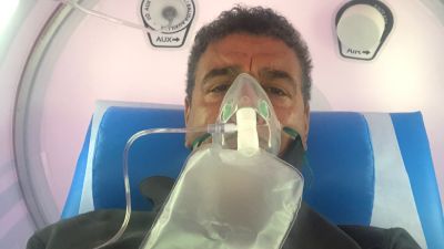 Chris Kamara receiving treatment in a oxygen chamber 