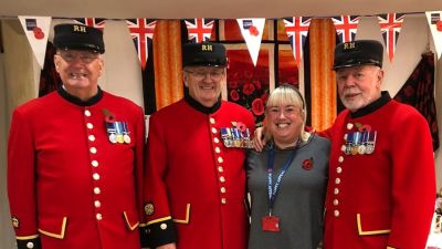 Tracey Williams, President of the RBL Jersey Branch with Chelsea Pensioners during the Poppy Appeal.