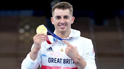 Great Britain's Max Whitlock celebrates with his gold medal after winning the Men's Pommel Horse Final at the Ariake Gymnastics Centre on the ninth day of the Tokyo 2020 Olympic Games