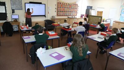 Children socially distancing in class.