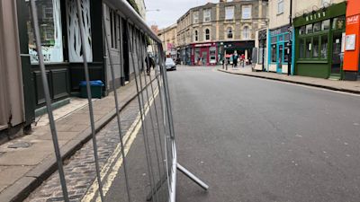 Barriers in the road outside businesses will give customers more space