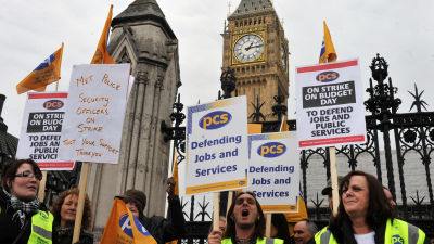 Civil service workers on strike outside the Houses of Parliament.