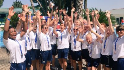 Hands up if you're going to Malaysia!  England Deaf Women's Football Team of Great Britain Deaf Women's football team celebrating the bronze medal trophy from the World Cup 2016