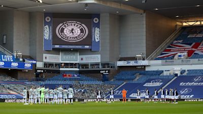 Rangers and Celtic players mark observe a minute's silence on the 50th anniversary of the Ibrox Disaster ahead of their Scottish Premiership match.