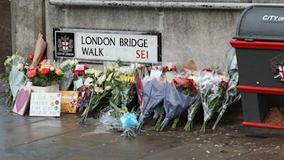 archive of Floral tributes for victims of the terrorist attack, including Jack Merritt, left on London Bridge (c) PA