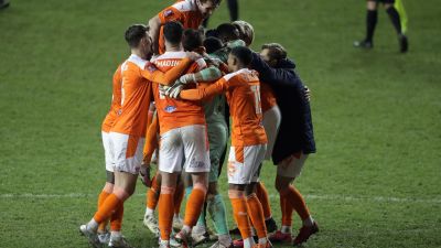 Blackpool players celebrate with goalkeeper Chris Maxwell after beating West Brom on penalties in the FA Cup